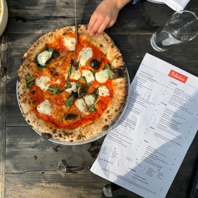 Enjoy evening New York style pizza alfresco.